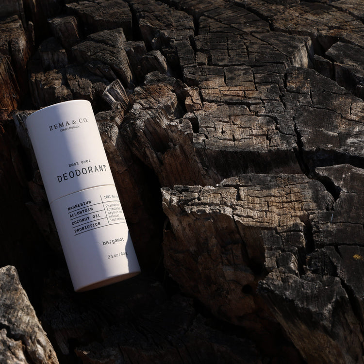 Deodorant stick on a rustic wooden surface